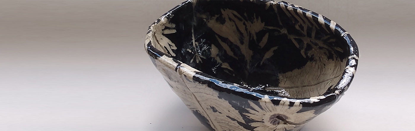 Dmud Ceramics displaying one of their handmade pottery bowls.