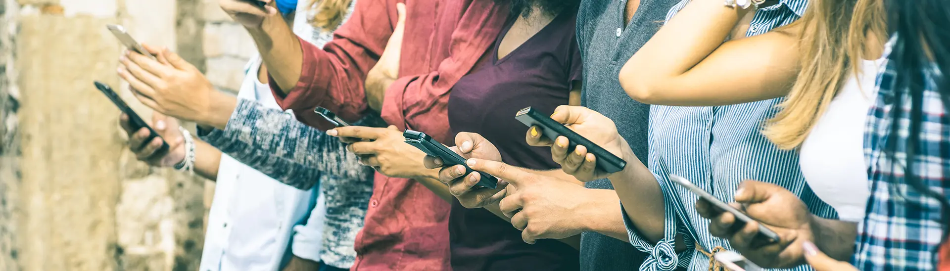 Group of people on their phone looking at digital media.