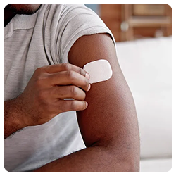 Man putting on nicotine patch