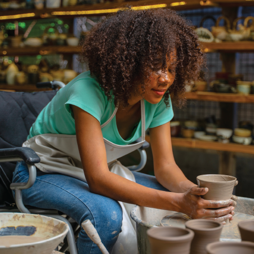 Money follows the person program banner of woman working on pottery.