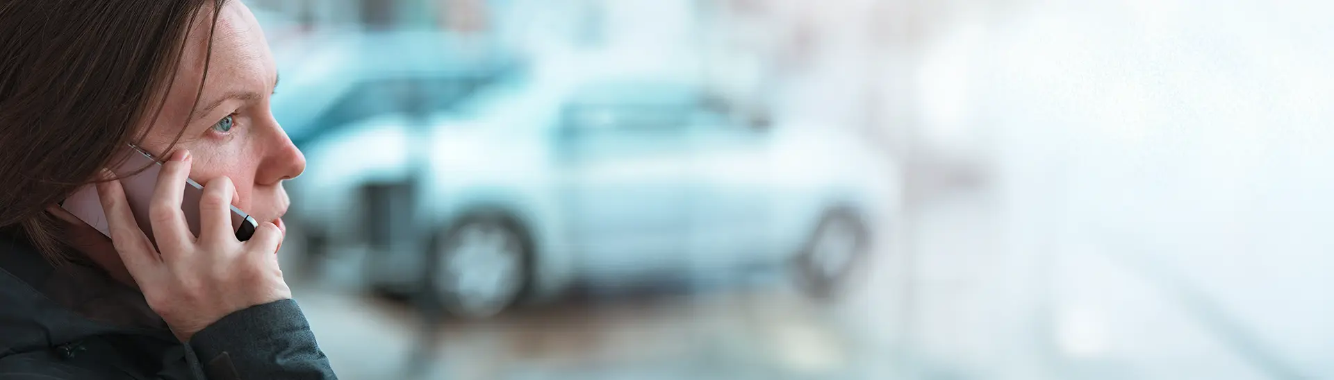 A woman on the phone calling for mobile crisis service help.